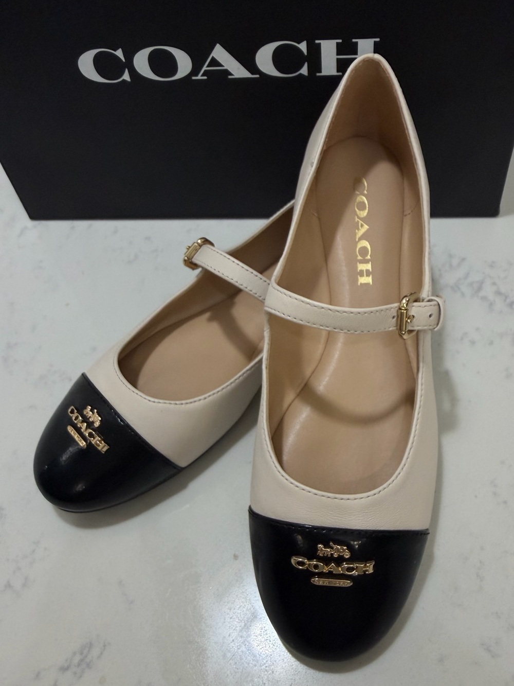 Coach Cream Leather Mary Janes with chalk/Black Patent Cap Toe and Gold Logo